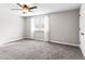 Bright bedroom with carpet, a ceiling fan, and a window that fills the room with natural light at 421 E Highline Cir, Centennial, CO 80122