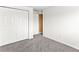 Bright bedroom features plush carpet, fresh paint and closet with folding doors at 421 E Highline Cir, Centennial, CO 80122