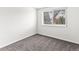 This is a neutral carpeted bedroom with a window and a natural view outside at 421 E Highline Cir, Centennial, CO 80122