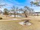 Landscaped community pond with walking paths, benches and views of the townhomes at 421 E Highline Cir, Centennial, CO 80122