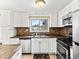 Well-lit kitchen with stainless steel appliances and tile backsplash at 421 E Highline Cir, Centennial, CO 80122