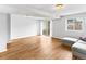 Light-filled living room features wood floors, a sliding glass door, and a comfortable sectional sofa at 421 E Highline Cir, Centennial, CO 80122