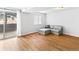 Bright living area features wood floors, a sliding glass door, and a gray sectional sofa at 421 E Highline Cir, Centennial, CO 80122