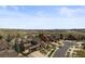 Aerial view of a spacious home in a suburban setting with scenic open space and walking path at 22475 E Hidden Trail Dr, Parker, CO 80138