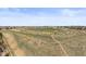 Aerial view showcasing the neighborhood's open fields and trails, near a school and residential area at 22475 E Hidden Trail Dr, Parker, CO 80138