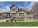 Spacious backyard featuring a patio, outdoor seating, and landscaped area for entertaining at 22475 E Hidden Trail Dr, Parker, CO 80138