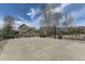 Wide backyard including a basketball court, built-in grill, and grassy area providing space for recreation at 22475 E Hidden Trail Dr, Parker, CO 80138