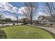 Backyard with basketball court, putting green, grill, and patio, blending recreation and relaxation at 22475 E Hidden Trail Dr, Parker, CO 80138