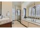 Luxurious bathroom with granite countertop, soaking tub, and glass-enclosed shower at 22475 E Hidden Trail Dr, Parker, CO 80138