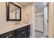 Well-lit bathroom features a marble vanity and a glass-enclosed shower with tiled walls at 22475 E Hidden Trail Dr, Parker, CO 80138