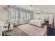 Bedroom with plush rug, soft natural light from the window, and decorative furniture at 22475 E Hidden Trail Dr, Parker, CO 80138