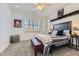 Comfortable bedroom featuring a ceiling fan, gray carpet, window shutters, and a padded bench at 22475 E Hidden Trail Dr, Parker, CO 80138