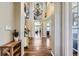 Grand entryway with soaring ceilings, elegant chandelier, and beautiful hardwood floors at 22475 E Hidden Trail Dr, Parker, CO 80138