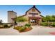 A unique barn-style building with attractive landscaping and a silo-shaped structure at 22475 E Hidden Trail Dr, Parker, CO 80138