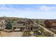 Charming home with stone accents, covered entry, well-manicured landscaping, and a welcoming three-car garage at 22475 E Hidden Trail Dr, Parker, CO 80138