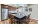 Eat-in kitchen featuring stainless appliances, granite counters, and an island with room for six at 22475 E Hidden Trail Dr, Parker, CO 80138
