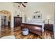 Comfortable main bedroom featuring wood floors and stylish decor at 22475 E Hidden Trail Dr, Parker, CO 80138