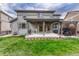 Backyard with a covered patio, an outdoor grill and a pergola with outdoor seating at 2618 Bellavista St, Castle Rock, CO 80109