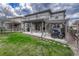 Backyard with a covered patio, an outdoor grill and a pergola with outdoor seating at 2618 Bellavista St, Castle Rock, CO 80109