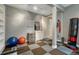 Basement gym area featuring a vanity, weights, and exercise equipment at 2618 Bellavista St, Castle Rock, CO 80109