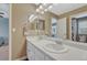 Clean bathroom featuring double sinks with modern faucets and ample lighting at 2618 Bellavista St, Castle Rock, CO 80109