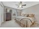 Comfortable bedroom with ceiling fan, carpet, and dresser with wall-mounted tv for easy viewing at 2618 Bellavista St, Castle Rock, CO 80109
