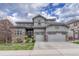 Charming two-story home boasts a three-car garage and tasteful stone accents at 2618 Bellavista St, Castle Rock, CO 80109