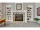 Close-up of the fireplace with stone surround and built-in bookshelves at 2618 Bellavista St, Castle Rock, CO 80109