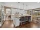 Bright kitchen featuring granite counters, white cabinetry, and stainless steel appliances at 2618 Bellavista St, Castle Rock, CO 80109