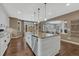 Spacious kitchen with a large island, granite countertops, and hardwood floors at 2618 Bellavista St, Castle Rock, CO 80109