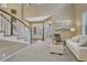 Comfortable living room with a staircase and a glimpse into the front entry way at 2618 Bellavista St, Castle Rock, CO 80109