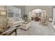 Cozy living room with neutral colors and views to the dining area through a colonnade at 2618 Bellavista St, Castle Rock, CO 80109