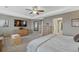 Expansive main bedroom with wood furnishings, a TV, and an ensuite bathroom at 2618 Bellavista St, Castle Rock, CO 80109