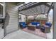 Outdoor patio area features comfortable seating, a fire pit table, and a privacy lattice wall at 2618 Bellavista St, Castle Rock, CO 80109