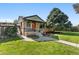 Charming front exterior with a well-maintained lawn and inviting entryway with bench seating at 2348 W Ford Pl, Denver, CO 80223