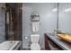 Full bathroom with a tub and shower combination and updated fixtures and finishes at 6680 E Mississippi Ave # 3, Denver, CO 80224