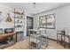 Bright dining area with natural light, open shelving, and casual seating for comfortable meals at 6680 E Mississippi Ave # 3, Denver, CO 80224