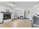 Cozy living room with a fireplace, wood floors, and comfortable seating, perfect for relaxation at 6680 E Mississippi Ave # 3, Denver, CO 80224