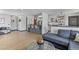 Open living space featuring a bar, comfortable seating, and natural light, creating an inviting atmosphere at 6680 E Mississippi Ave # 3, Denver, CO 80224