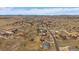 Expansive aerial view showcasing the neighborhood, homes, and mountain backdrop at 7635 Weaver Cir, Castle Rock, CO 80104