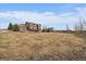 Large backyard with earth-tone home in background at 7635 Weaver Cir, Castle Rock, CO 80104