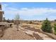 Backyard featuring a rock garden, small trees, and a gravel pathway at 7635 Weaver Cir, Castle Rock, CO 80104