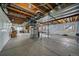 Spacious unfinished basement with concrete floor, exposed ceiling, and ample room at 7635 Weaver Cir, Castle Rock, CO 80104