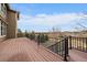 Exterior deck with wood flooring and metal railing, offering picturesque views at 7635 Weaver Cir, Castle Rock, CO 80104