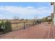 Exterior deck overlooking well-manicured backyard and distant houses at 7635 Weaver Cir, Castle Rock, CO 80104
