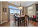 Bright dining area with large windows and sliding door to a deck perfect for enjoying meals with a view at 7635 Weaver Cir, Castle Rock, CO 80104