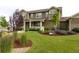 Charming home with well-maintained lawn and mature landscaping at 7635 Weaver Cir, Castle Rock, CO 80104