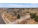 Beautiful two-story home with a three car garage, landscaped yard and basketball court on a manicured lot at 7635 Weaver Cir, Castle Rock, CO 80104