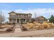 Two story home with welcoming porch and drought resistant landscaping at 7635 Weaver Cir, Castle Rock, CO 80104