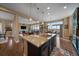 Open-concept kitchen seamlessly connects to the living and dining areas, offering a perfect space for entertaining and Gathering gatherings at 7635 Weaver Cir, Castle Rock, CO 80104